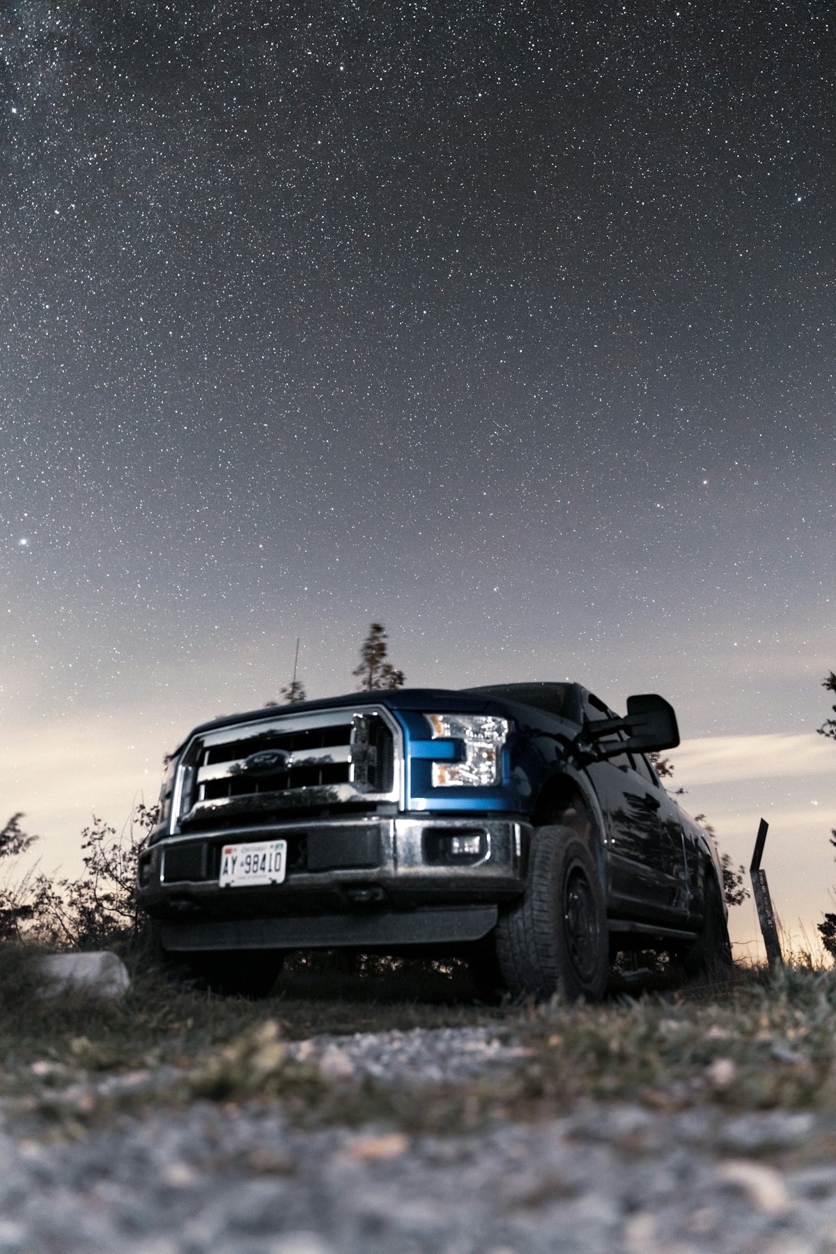 black suv on brown field during night time