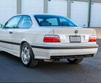 Euro style red/clear tail lights installed on a white BMW E36 coupe