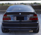 Rear view of a BMW E46 330i sedan with Euro red/smoke tail lights installed