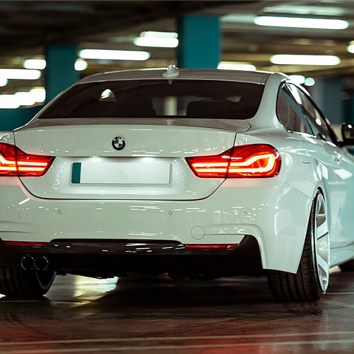 LCI-style LED tail lights installed on a white BMW 4 Series Gran Coupe