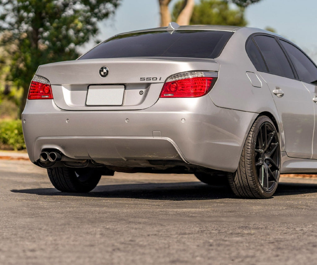 Facelift style LED tail lights installed on a silver BMW E60 550i sedan