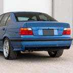 OE style tail lights installed on a blue BMW E36 sedan