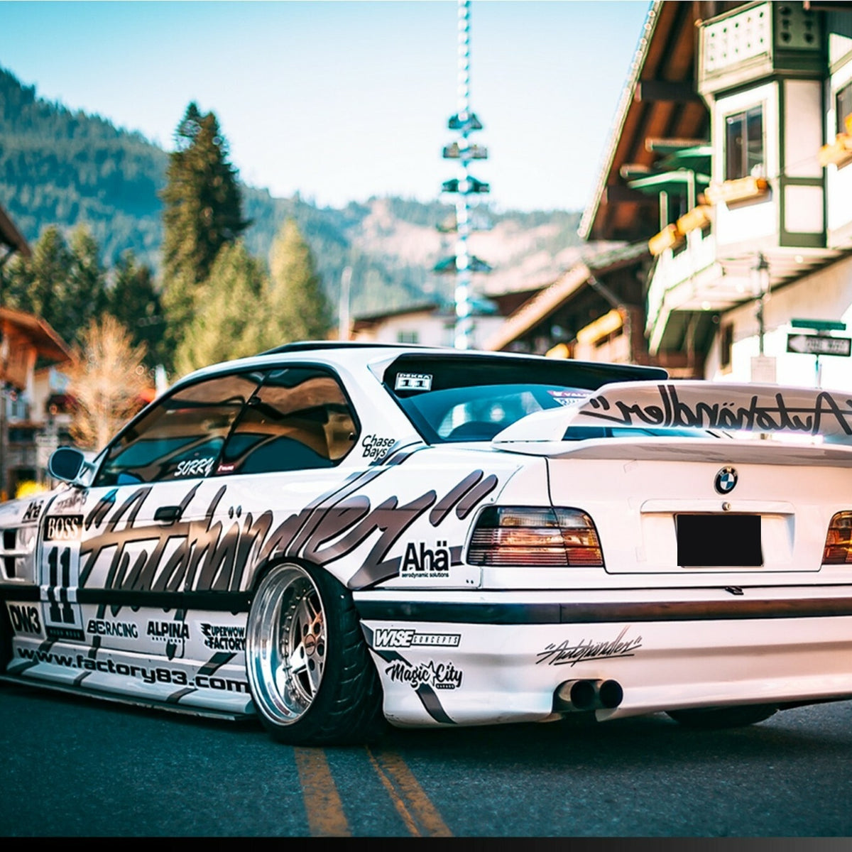 Euro smoke gray tail lights installed on a white BMW E36 coupe