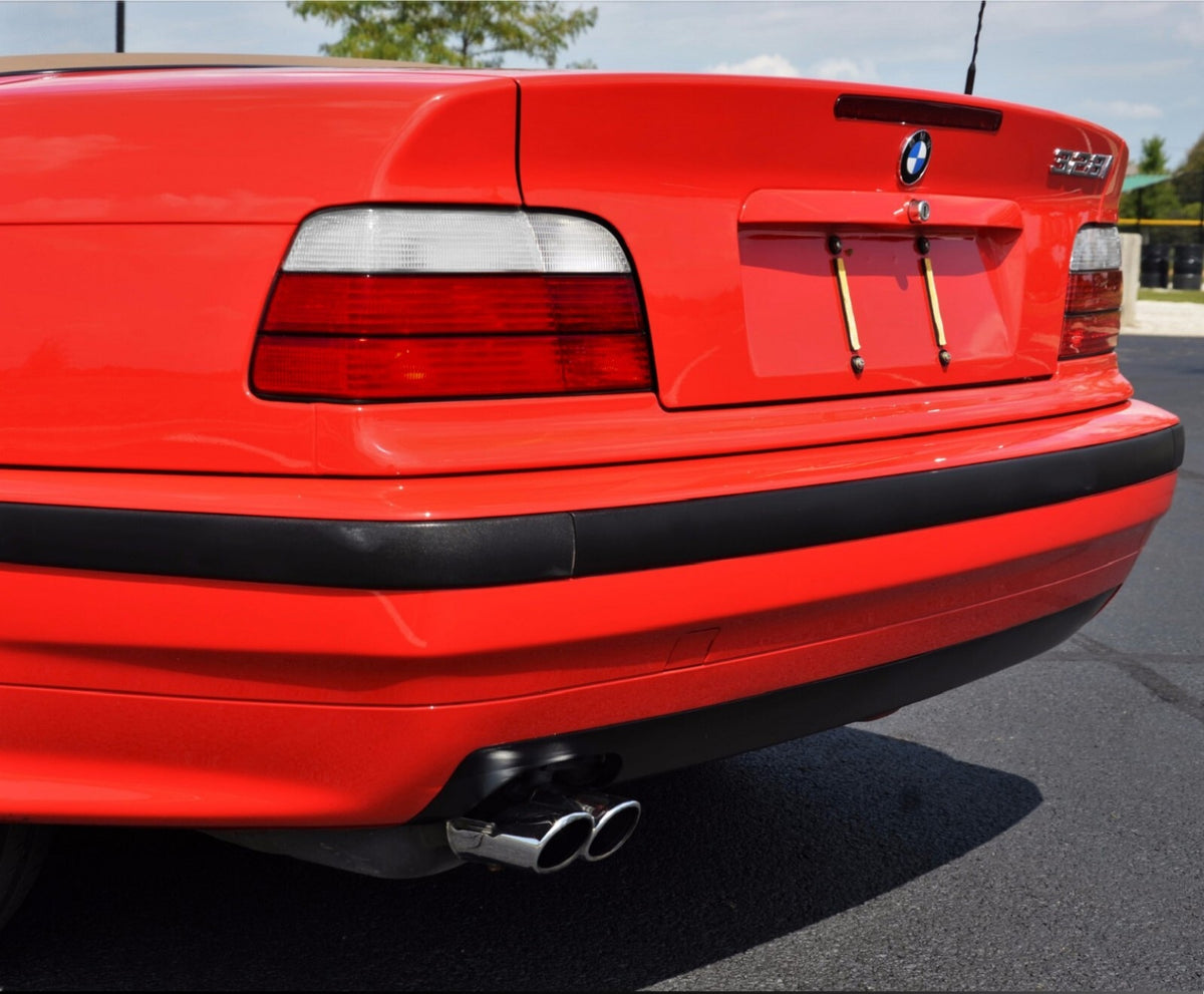 Euro style red/clear tail lights installed on a red BMW E36 328i