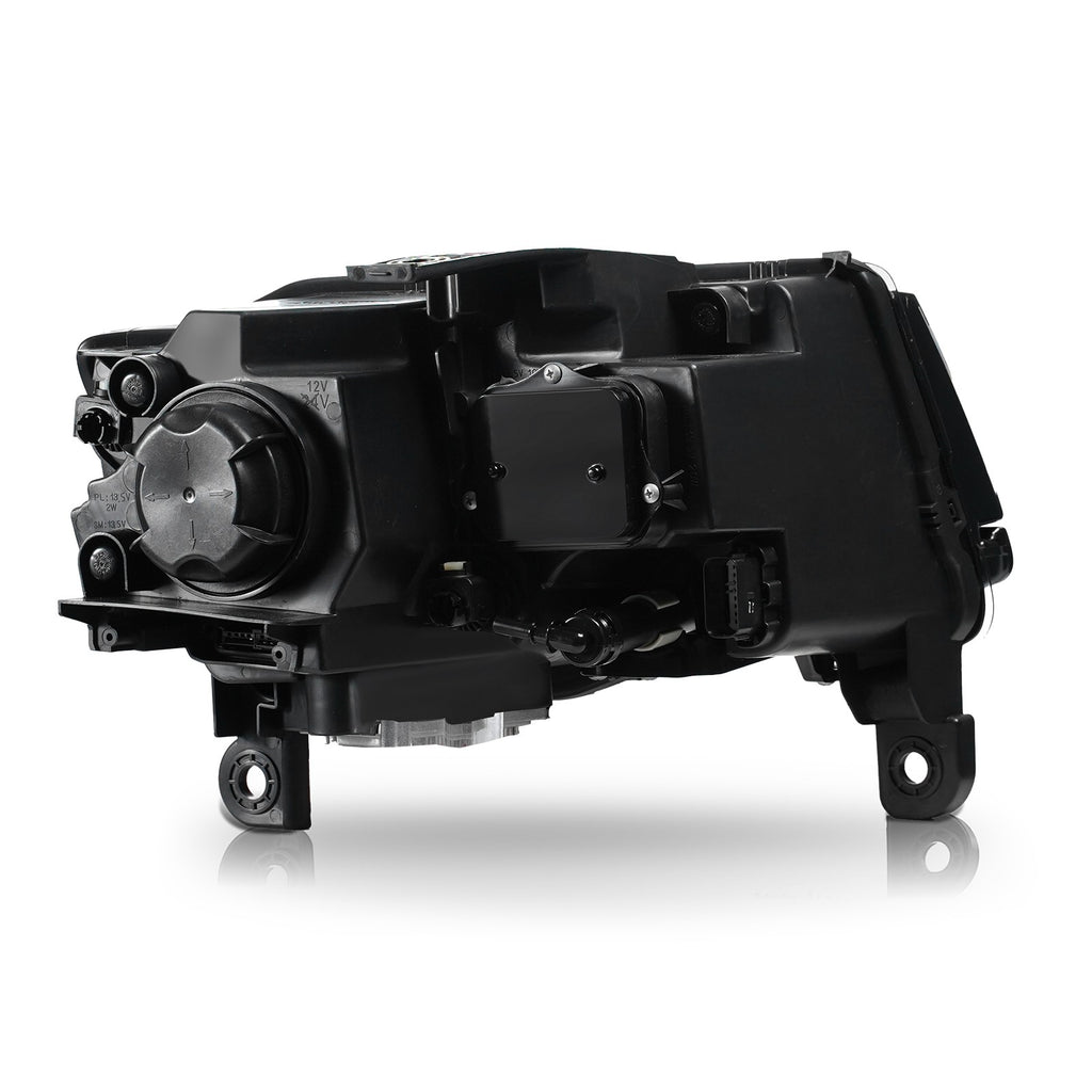 Left HID headlight lens close-up for 2014-2016 Jeep Grand Cherokee
