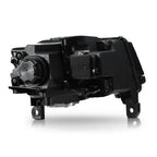 Left HID headlight lens close-up for 2014-2016 Jeep Grand Cherokee