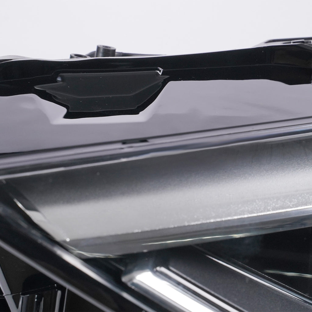 Left LED headlight lens close-up for 2019-2025 Audi Q3