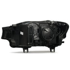 Left halogen projector headlight lens close-up for 2015-2018 BMW X3