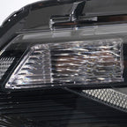 Left halogen projector headlight lens close-up for 2016-2018 Chevy Malibu