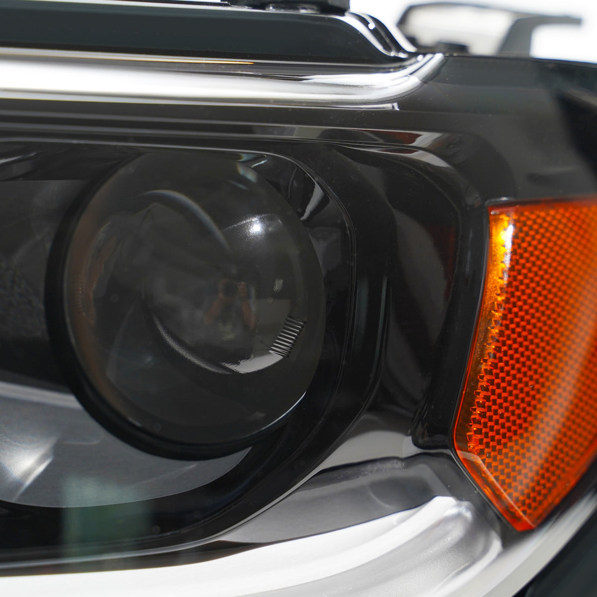 Left halogen projector headlight lens close-up for 2017-2021 Jeep Compass