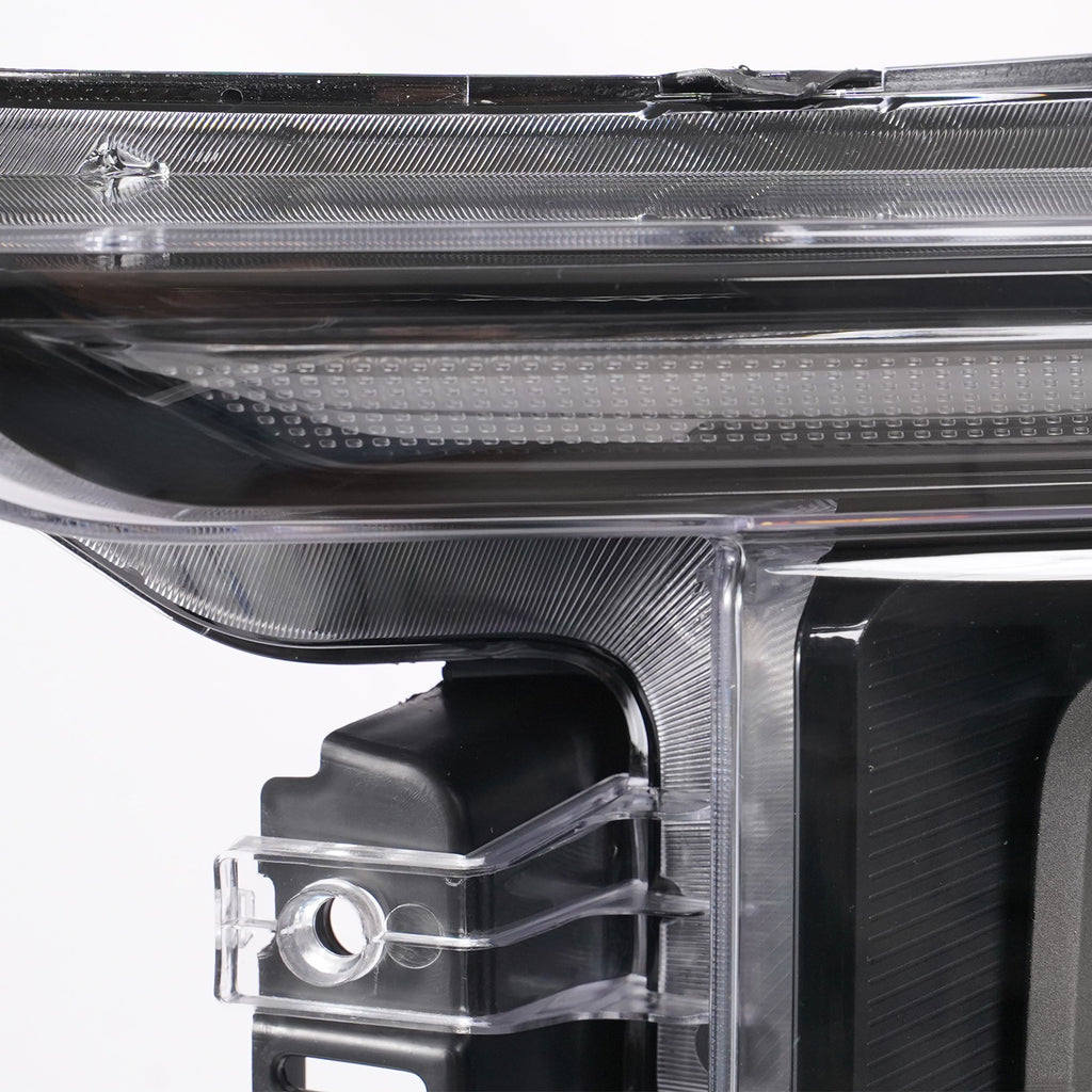Left LED headlight lens close-up for 2021-2023 Ford F-150 Raptor
