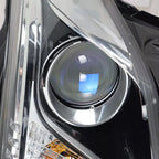 Left halogen projector headlight lens close-up for 2013-2018 Cadillac ATS