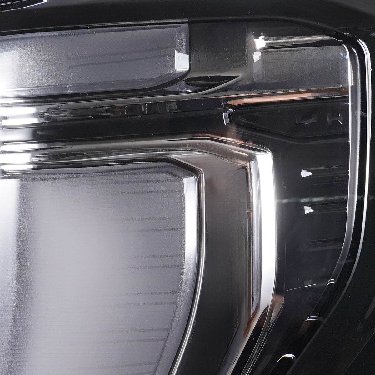 Right LED headlight lens close-up for 2025-2026 GMC Yukon / Yukon XL AT4 / Elevation