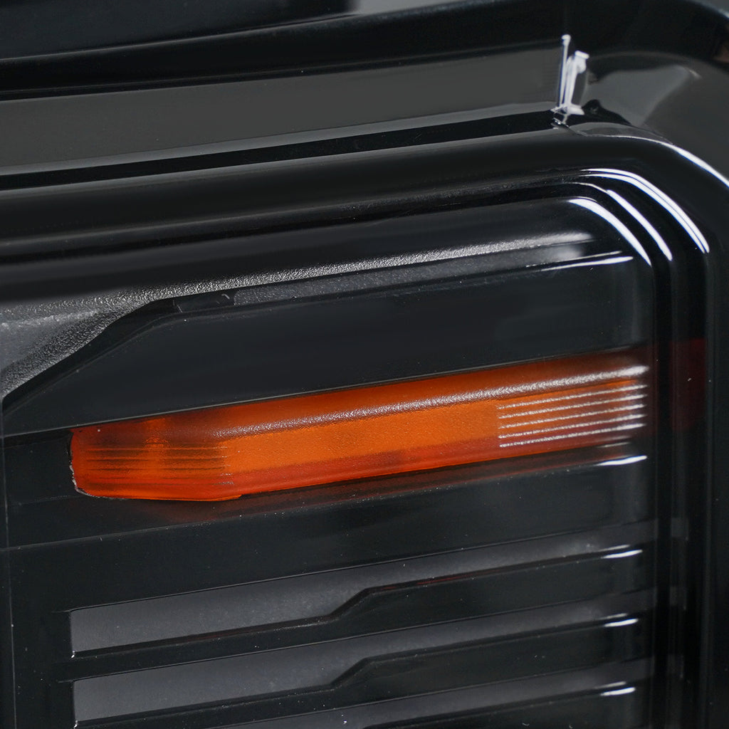 Left LED headlight lens close-up for 2024-2026 GMC Acadia AT4 / Elevation