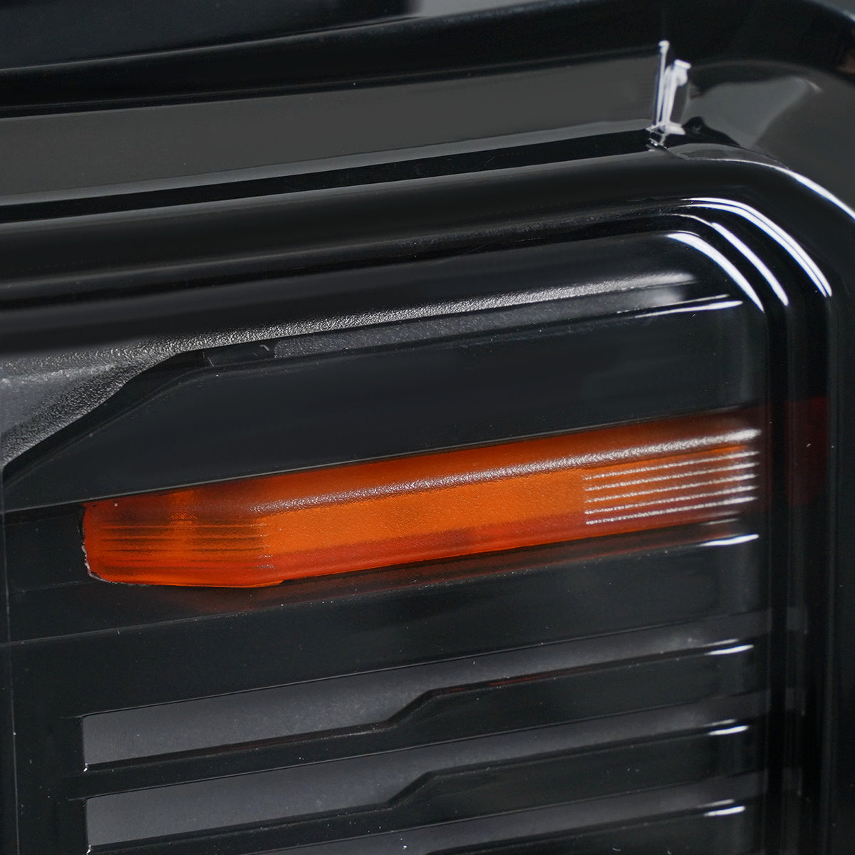 Left LED headlight lens close-up for 2024-2026 GMC Acadia AT4 / Elevation