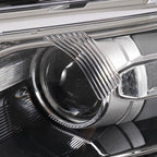 Left halogen projector headlight lens close-up for 2013-2014 Ford Taurus