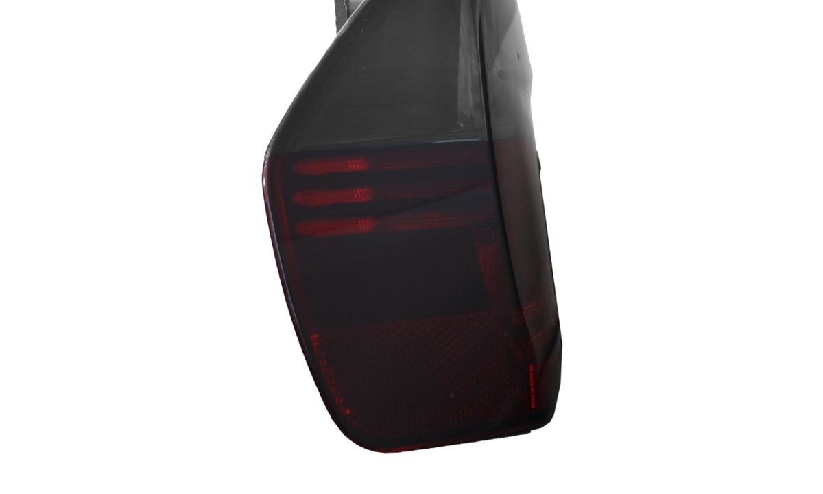 Side profile of the red/smoke E90 sedan tail light