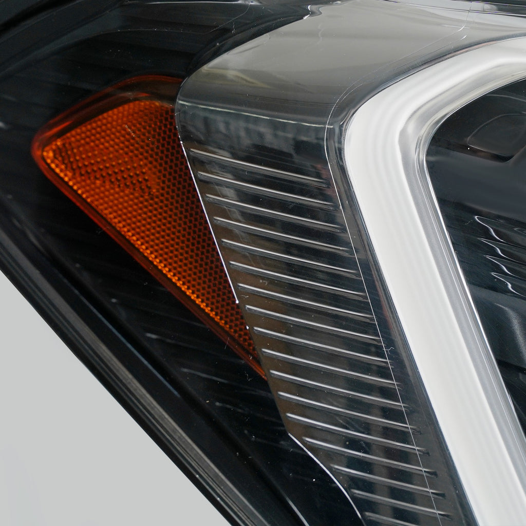 Right LED projector headlight lens close-up for 2018-2021 Ford Expedition