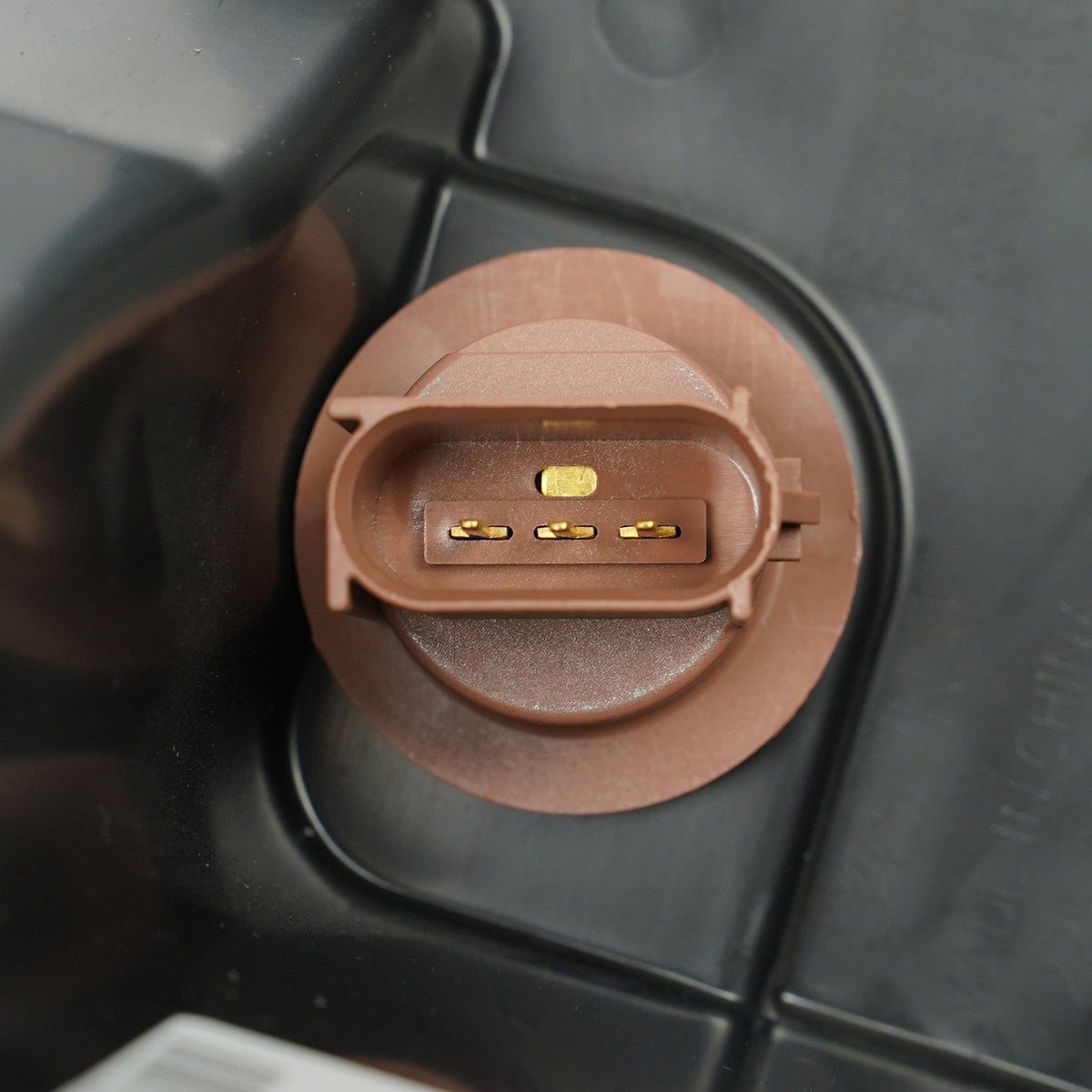 Halogen headlight connector close-up for 2010-2012 Ford Fusion