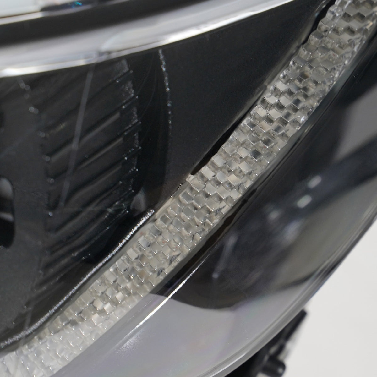 Right halogen projector headlight lens close-up for 2016-2018 Chevy Malibu