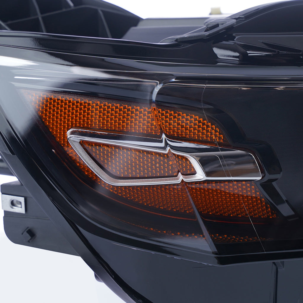Left halogen projector headlight lens close-up for 2014-2020 Chevy Impala