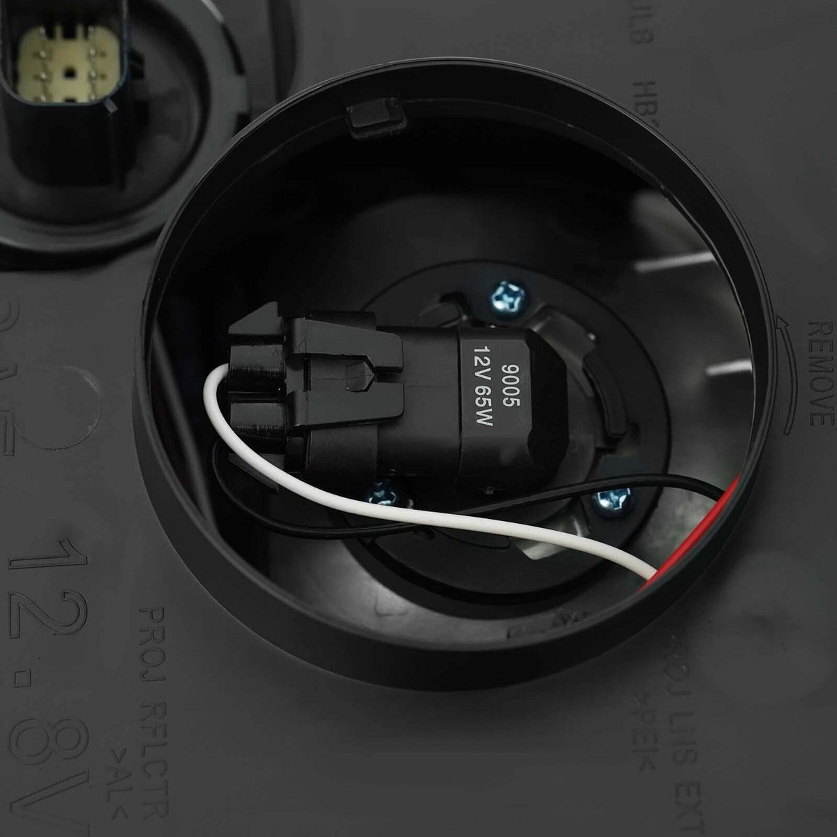 Right HID headlight lens close-up for 2015-2020 GMC Yukon