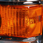 Right halogen projector headlight lens close-up for 2015-2019 GMC Sierra HD