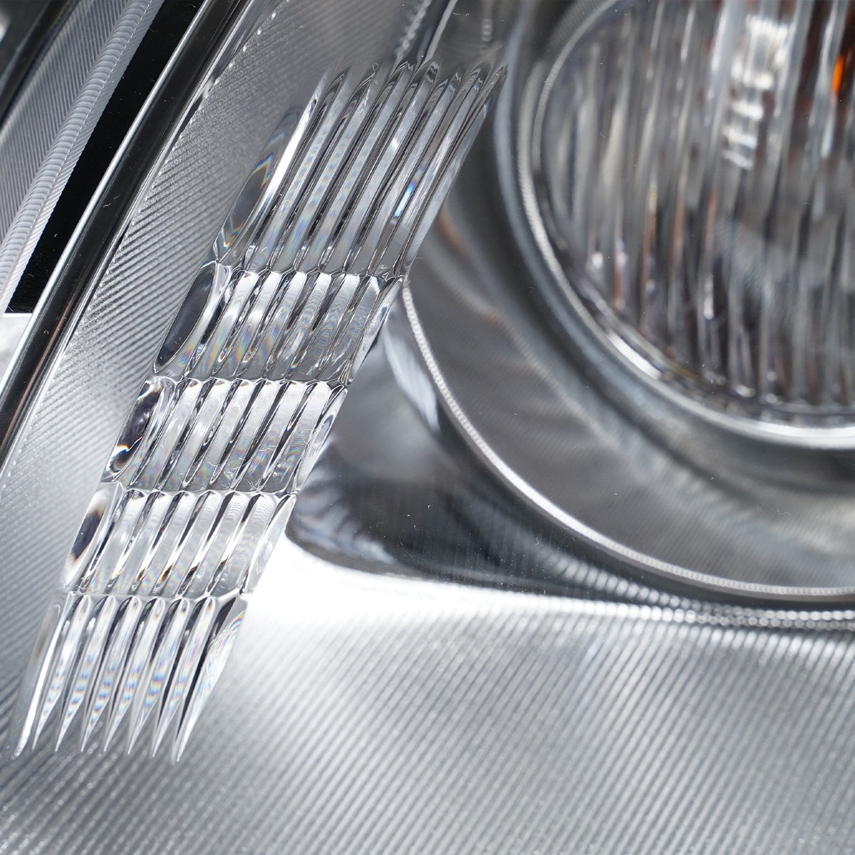Left HID headlight lens close-up for 2008-2012 Buick Enclave