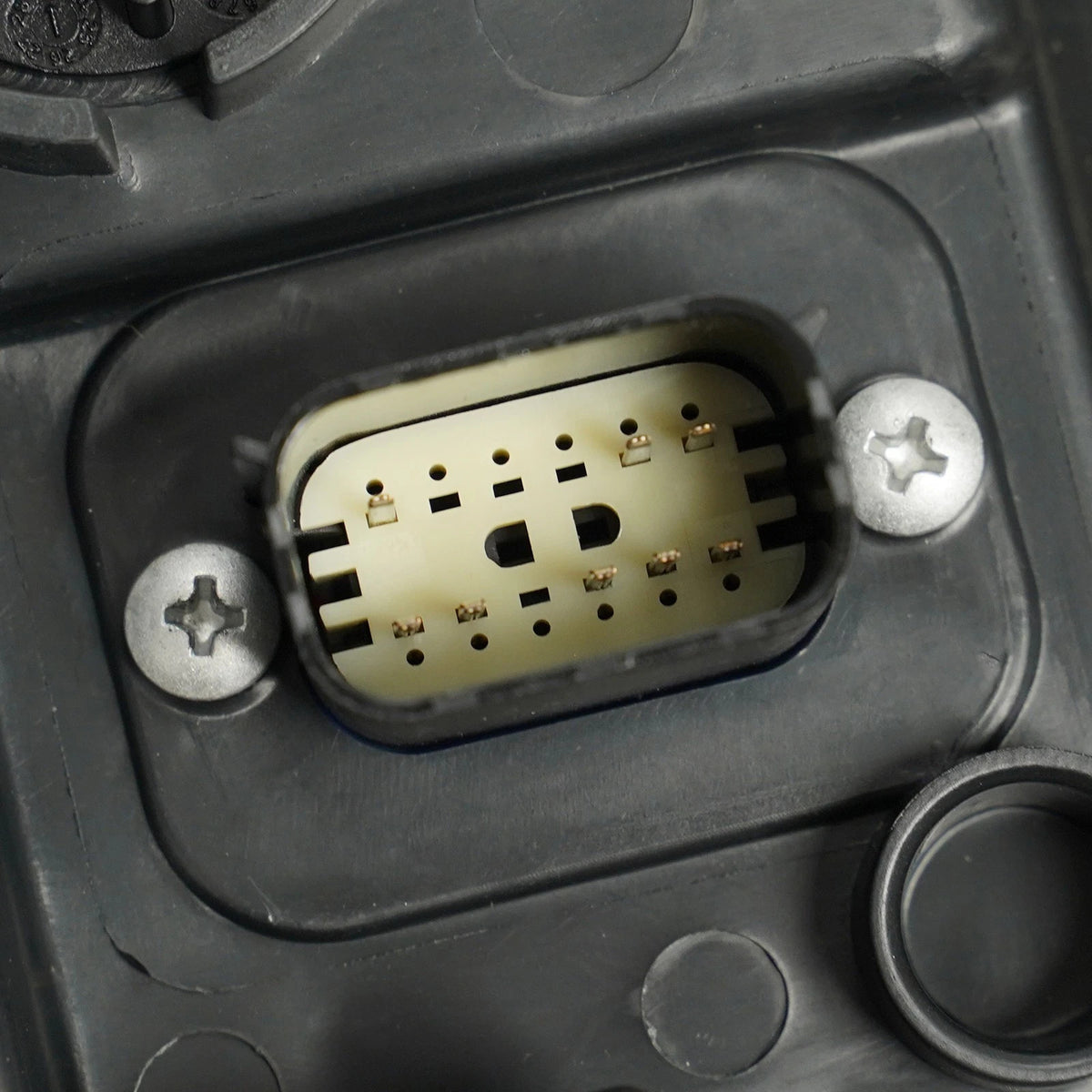 Halogen headlight mounting tab close-up for 2015-2017 Chrysler 200