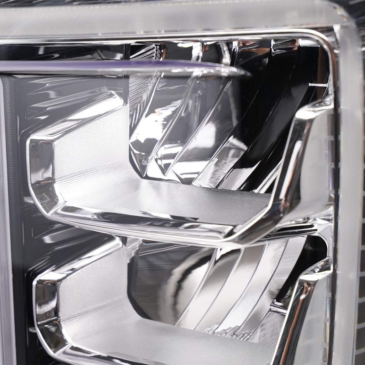 Right LED headlight lens close-up for 2020-2023 GMC Sierra HD
