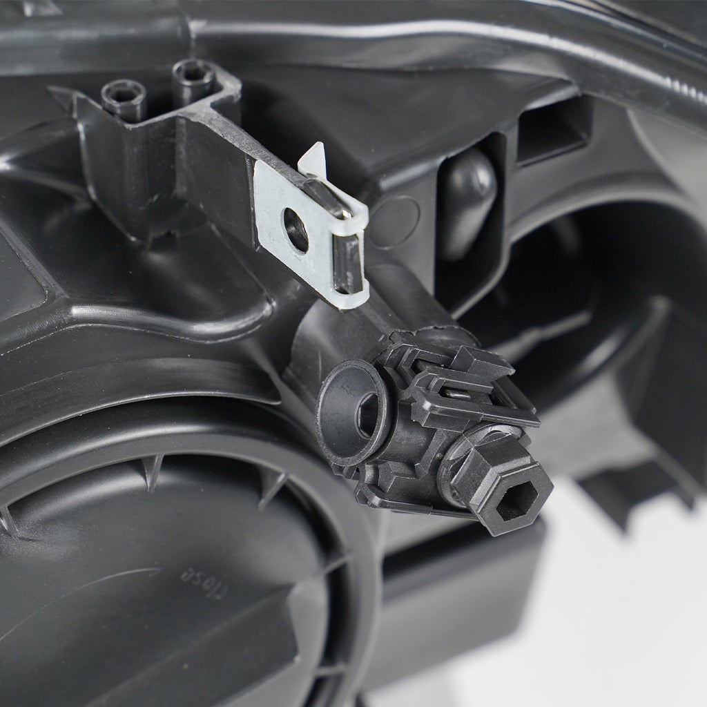 Halogen headlight mounting tab close-up for 2011-2014 BMW X3 F25
