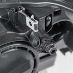 Halogen headlight mounting tab close-up for 2011-2014 BMW X3 F25
