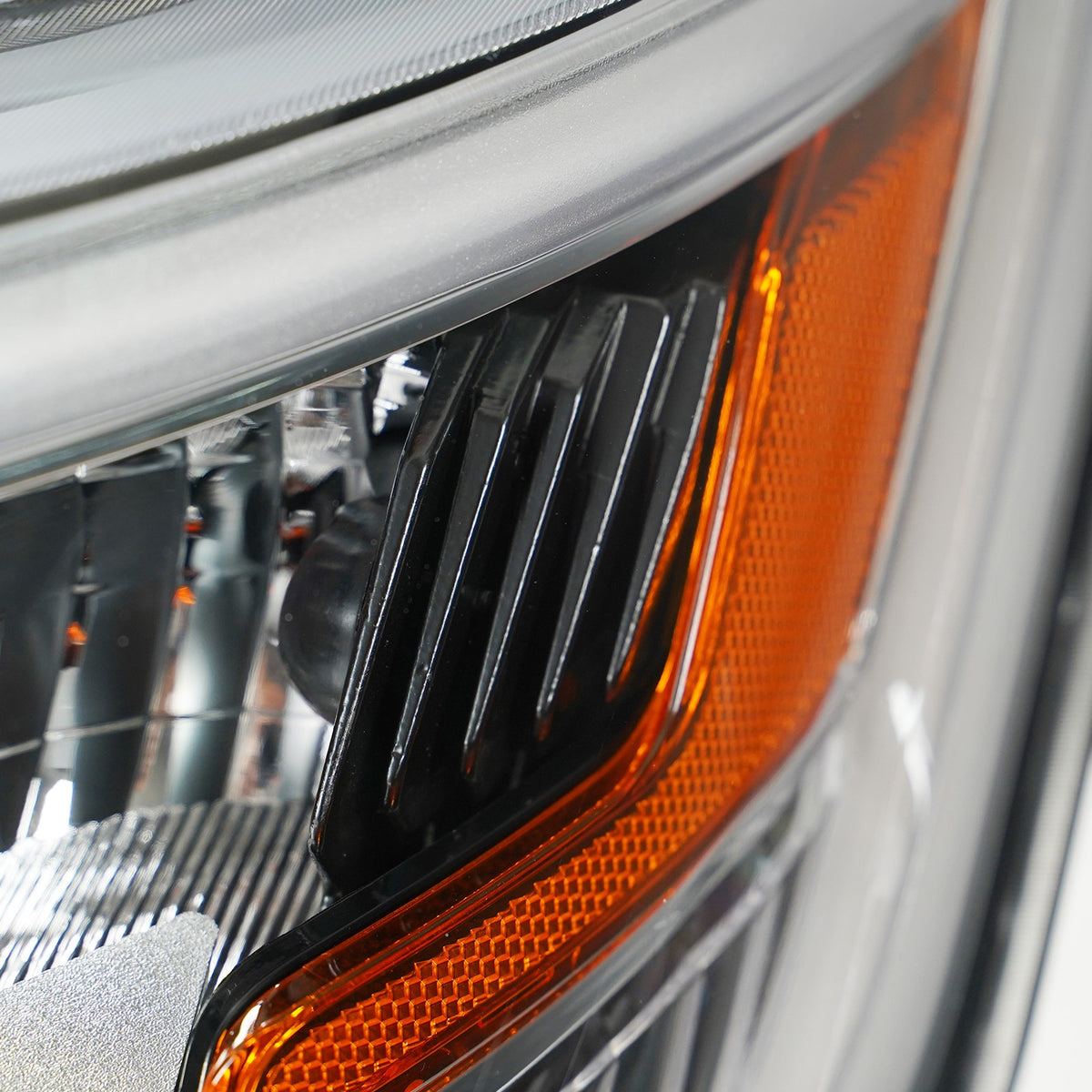 Led headlight mounting tab close-up for 2016-2018 Ford Explorer