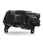 Right HID headlight lens close-up for 2014-2016 Jeep Grand Cherokee