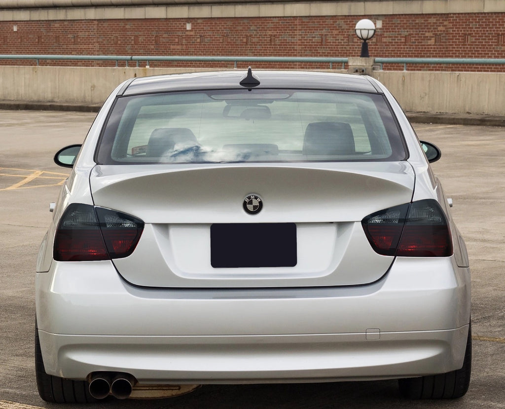 2006-2008 BMW 3 Series E90 sedan with red/smoke tail lights installed