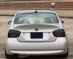 2006-2008 BMW 3 Series E90 sedan with red/smoke tail lights installed