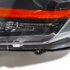Halogen headlight mounting tab close-up for 2008-2014 Cadillac CTS