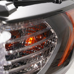 Halogen projector headlight mounting tab close-up for 2013-2016 Ford Fusion