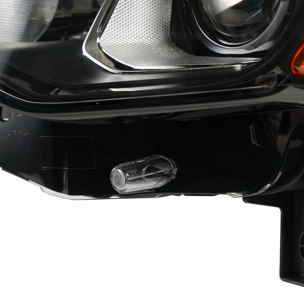 Halogen projector headlight mounting tab close-up for 2017-2021 Jeep Grand Cherokee