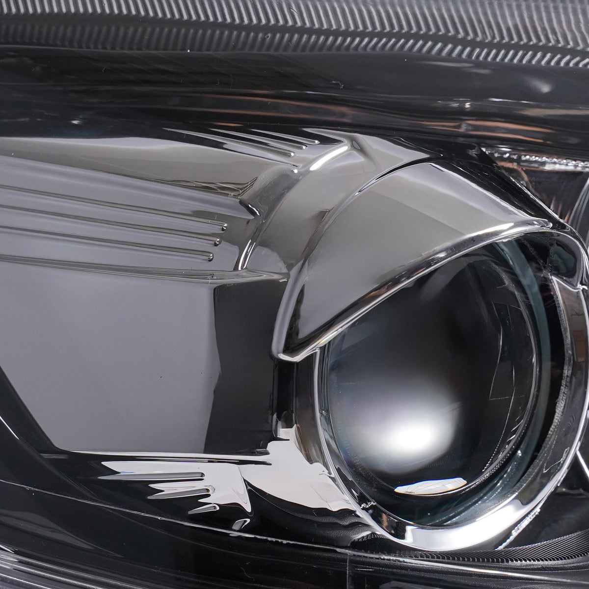 Halogen projector headlight mounting tab close-up for 2012-2014 Ford Focus
