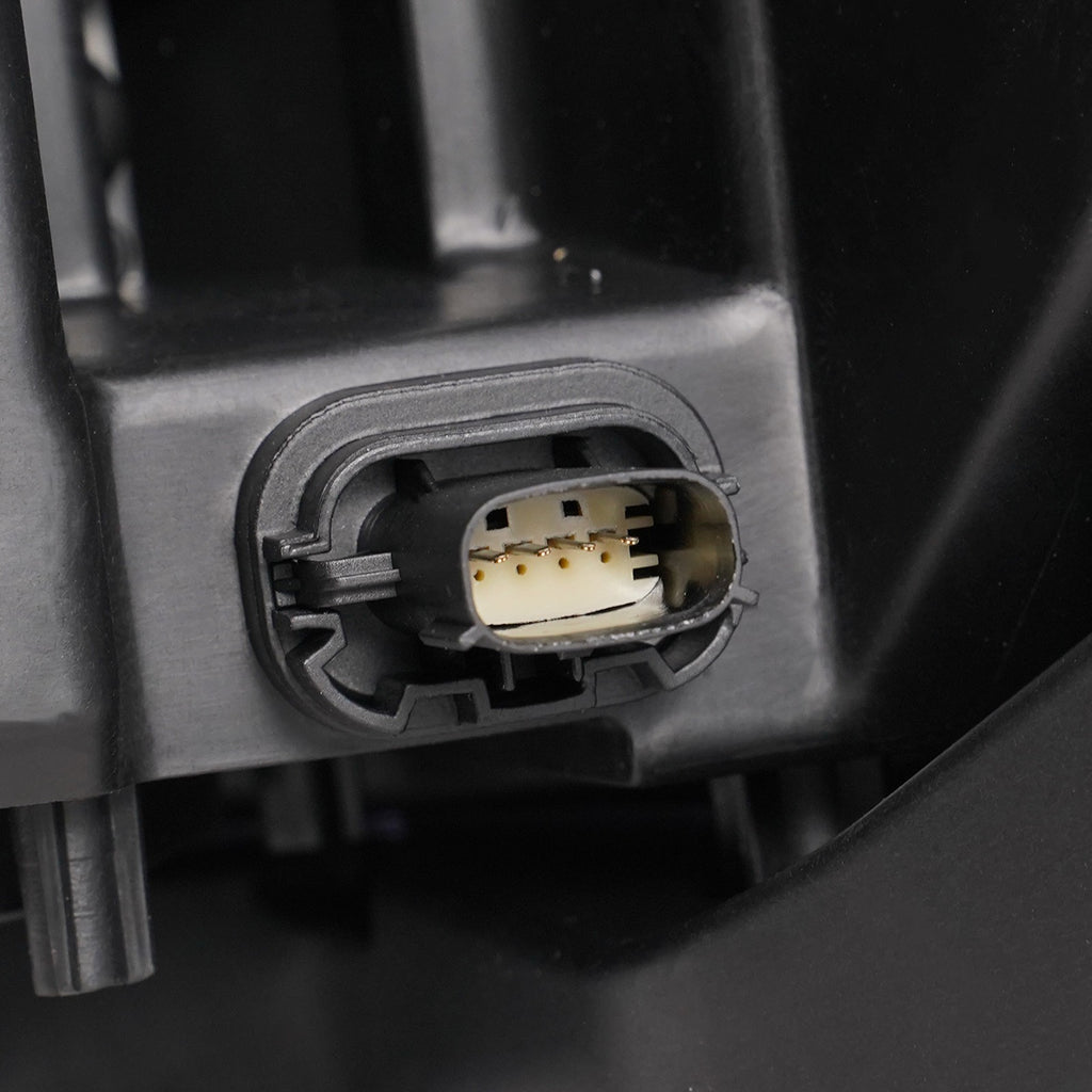 Halogen projector headlight mounting tab close-up for 2013-2014 Ford Taurus