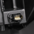 Halogen projector headlight mounting tab close-up for 2013-2014 Ford Taurus