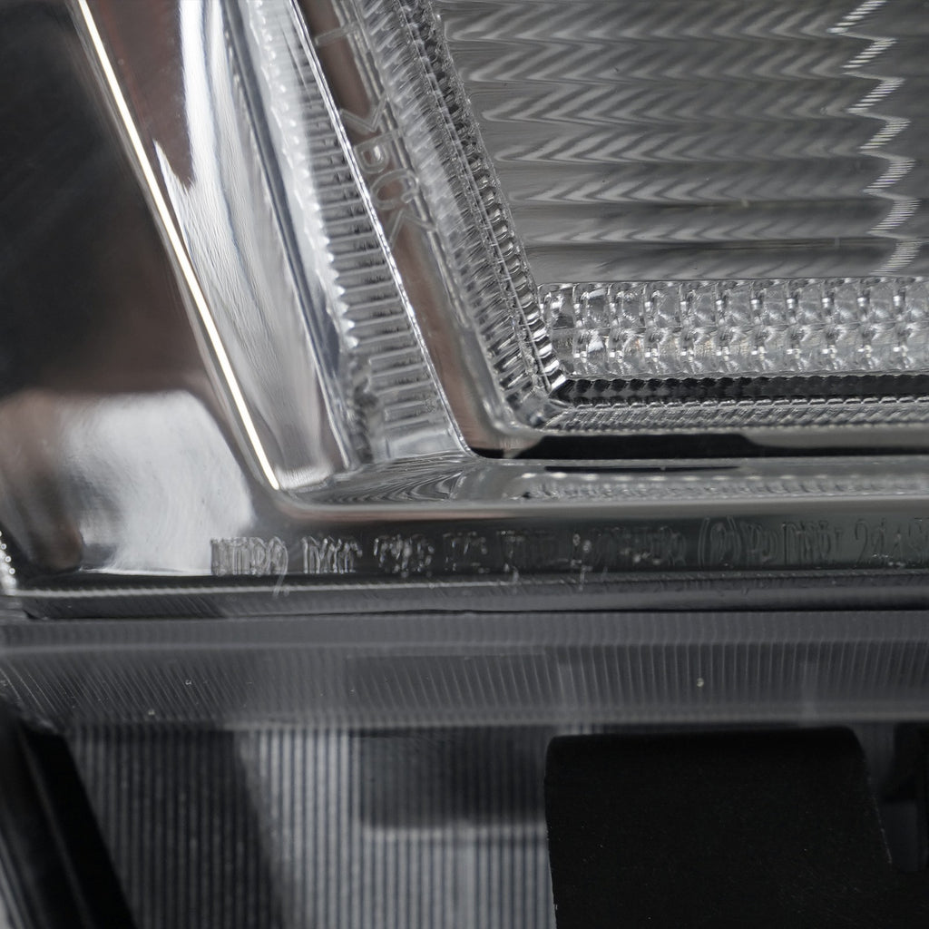 Halogen projector headlight bulb socket close-up for 2015-2019 GMC Sierra HD