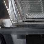Halogen projector headlight bulb socket close-up for 2015-2019 GMC Sierra HD