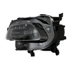 Right HID headlight lens close-up for 2014-2018 Jeep Cherokee