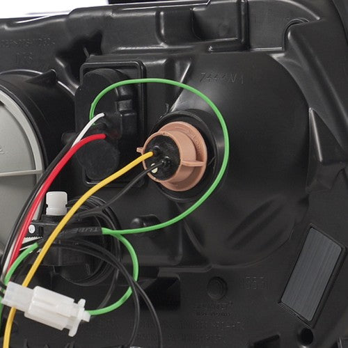 Projector headlight mounting tab close-up for 2010-2014 Ford Mustang