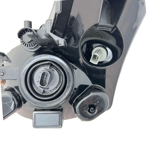 Halogen headlight mounting tab close-up for 2008-2011 Ford Focus
