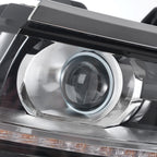 Halogen projector headlight DOT marking close-up for 2015-2020 Chevy Tahoe