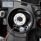 Halogen projector headlight inner detail close-up for 2013-2014 Ford Taurus