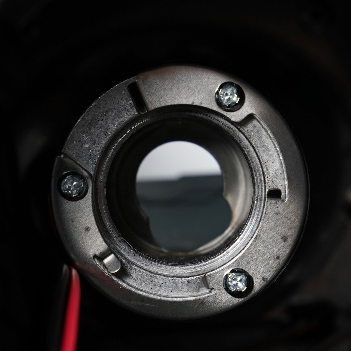 Halogen projector headlight DOT marking close-up for 2015-2019 GMC Sierra HD